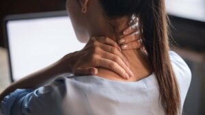 a patient struggling with neck pain